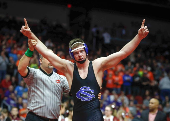 Central Springs senior Zach Ryg celebrates a Class 1A state title win over Mason City Newman Catholic's Chase McCleish at 195 pounds on Saturday, Feb. 16, 2019, at Wells Fargo Arena in Des Moines.