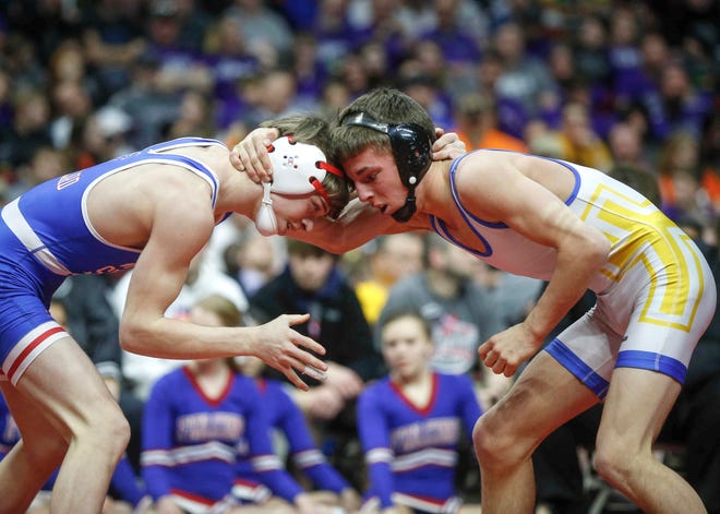 West Sioux junior Adam Allard, left, locks up with Don Bosco senior Daniel Kimball in their match at 120 during the state wrestling Class 1A finals on Saturday, Feb. 16, 2019, at Wells Fargo Arena in Des Moines.