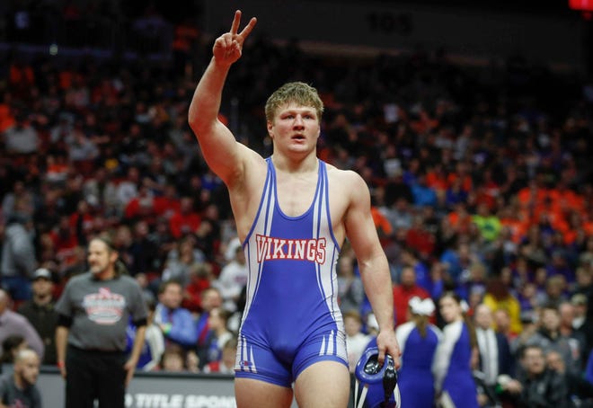 AHSTW senior Gabe Pauley celebrates after scoring an overtime win against Don Bosco junior Thomas Even for a Class 1A state championship win at 182 pounds on Saturday, Feb. 16, 2019, at Wells Fargo Arena in Des Moines.