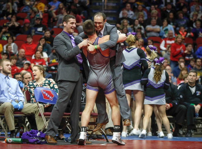 GTRA junior Treyton Cacek celebrates a Class 1A state title win with his coaches after beating Western Christian sophomore Tristan Mulder at 170 pounds on Saturday, Feb. 16, 2019, at Wells Fargo Arena in Des Moines.