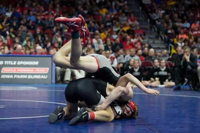 Ankeny Centennial's Eric Owens wrestles North Scott's Collin Lewis during the 145 pound class 3A championship match during the Iowa high school state wrestling tournament on Saturday, Feb. 16, 2019, in Wells Fargo Arena.