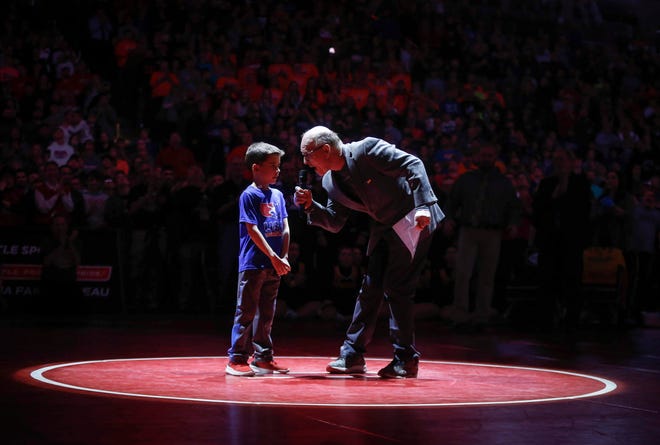 Iowa wrestling legend Dan Gable and 7-year-old Sebastiano Fidone helped kick off the 2019 Iowa high school state wrestling championships on Saturday, Feb. 16, 2019, at Wells Fargo Arena in Des Moines.