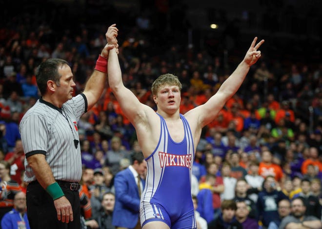 AHSTW senior Gabe Pauley celebrates after scoring an overtime win against Don Bosco junior Thomas Even for a Class 1A state championship win at 182 pounds on Saturday, Feb. 16, 2019, at Wells Fargo Arena in Des Moines.