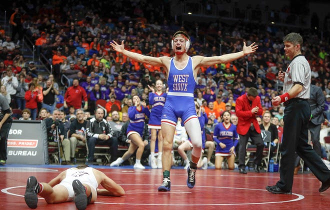 West Sioux senior Kory Van Oort celebrates after beating North Linn senior Brady Henderson in their match at 152 pounds during the state wrestling Class 1A championship on Saturday, Feb. 16, 2019, at Wells Fargo Arena in Des Moines.