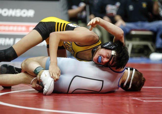 New London freshman Marcel Lopez gets around Underwood's Stevie Barnes in their match at 106 pounds during the state wrestling Class 1A championship on Saturday, Feb. 16, 2019, at Wells Fargo Arena in Des Moines.