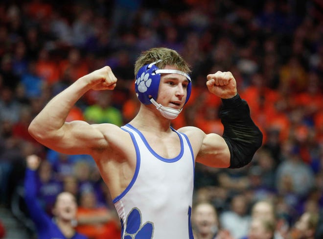 Woodbury Central junior Wade Mitchell celebrates after beating Emmetsburg senior Spencer Griffin for a Class 1A state title win at 145 pounds on Saturday, Feb. 16, 2019, at Wells Fargo Arena in Des Moines.
