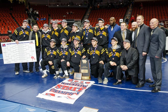 Waverly-Shell Rock poses for a photo after winning the 3A traditional team championship at the Iowa state wrestling championships on Saturday, Feb. 16, 2019 in Des Moines.