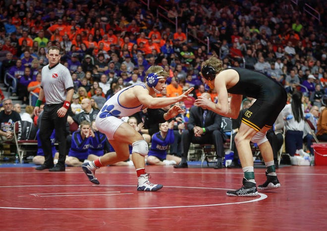 Woodbury Central junior Wade Mitchell, left, battles Emmetsburg senior Spencer Griffin en route to a Class 1A state title win at 145 pounds on Saturday, Feb. 16, 2019, at Wells Fargo Arena in Des Moines.