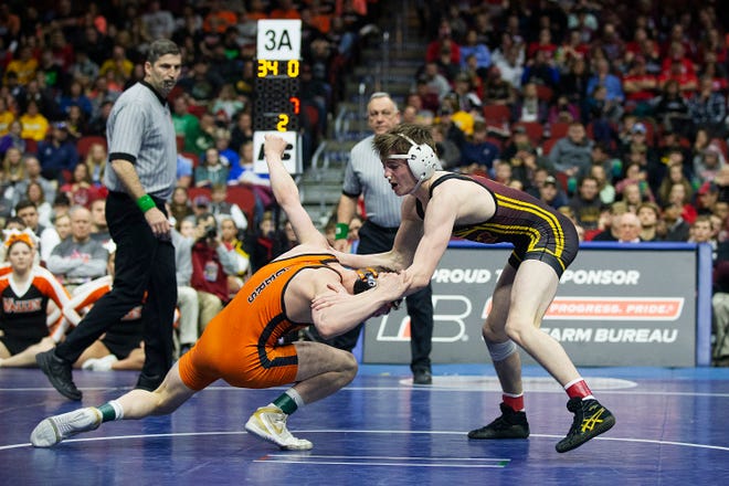 Ankeny's Caleb Rathjen wrestles West Des Moines Valley's Nick Oldham during the 126 pound class 3A championship match during the Iowa high school state wrestling tournament on Saturday, Feb. 16, 2019, in Wells Fargo Arena.