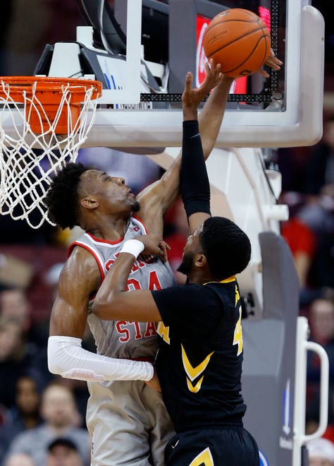 Ohio State forward Andre Wesson, left, blocks a shot by Iowa guard Isaiah Moss during the second half of an NCAA college basketball game in Columbus, Ohio, Tuesday, Feb. 26, 2019. Ohio State won 90-70.