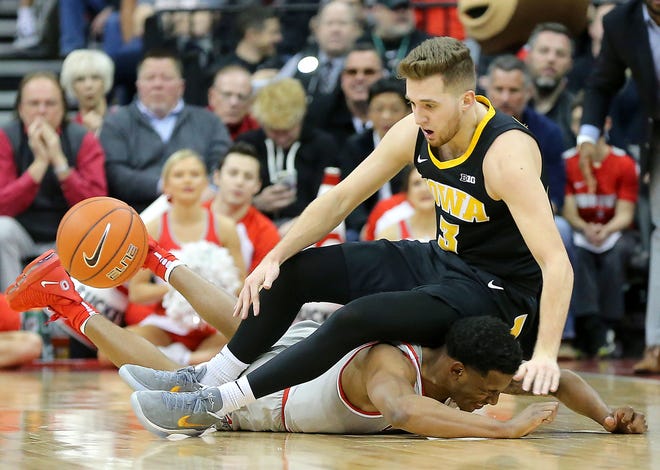Feb 26, 2019; Columbus, OH, USA; Ohio State Buckeyes guard C.J. Jackson (3) battles for the ball with Iowa Hawkeyes guard Jordan Bohannon (3) during the first half at Value City Arena.