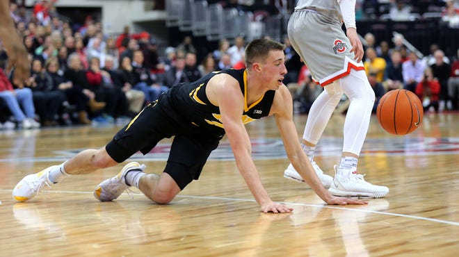 Feb 26, 2019; Columbus, OH, USA; Iowa Hawkeyes guard Joe Wieskamp (10) looses the ball during the second half against the Ohio State Buckeyes at Value City Arena.
