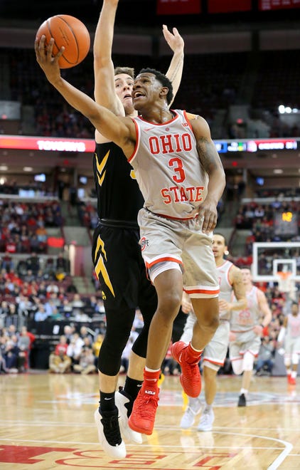 Feb 26, 2019; Columbus, OH, USA; Ohio State Buckeyes guard C.J. Jackson (right) drives past Iowa Hawkeyes guard Jordan Bohannon (left) during the first half at Value City Arena.