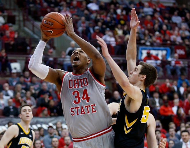 Ohio State forward Kaleb Wesson, left, goes up for a shot next to Iowa forward Nicholas Baer during the second half of an NCAA college basketball game in Columbus, Ohio, Tuesday, Feb. 26, 2019. Ohio State won 90-70.