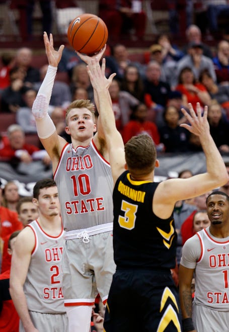 Ohio State forward Justin Ahrens, left, goes up for a shot against Iowa guard Jordan Bohannon during the second half of an NCAA college basketball game in Columbus, Ohio, Tuesday, Feb. 26, 2019. Ohio State won 90-70.
