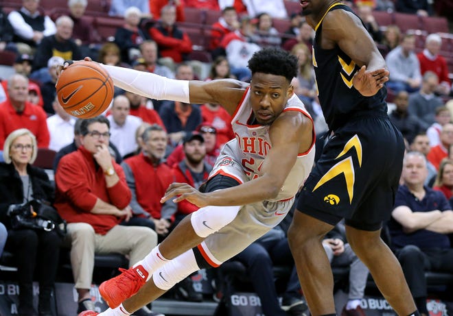 Feb 26, 2019; Columbus, OH, USA; Ohio State Buckeyes forward Andre Wesson (24) dribbles around Iowa Hawkeyes forward Tyler Cook (25) during the first half at Value City Arena.