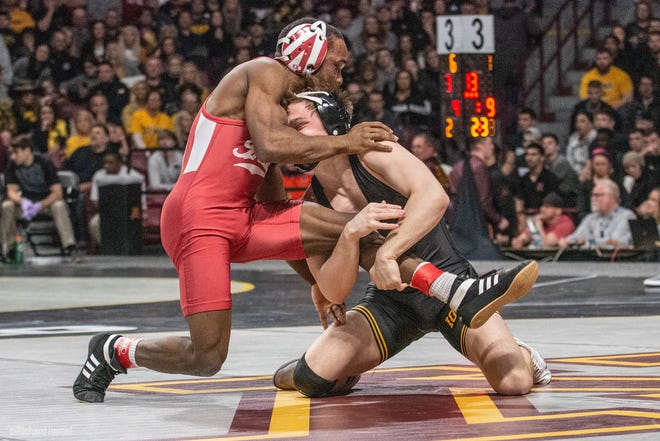 Iowa's Spencer Lee works for a takedown against Indiana's Elijah Oliver at the 2019 Big Ten Championships at Williams Arena in Minneapolis, Minnesota. Lee pinned Oliver in the first period to advance at 125 pounds.