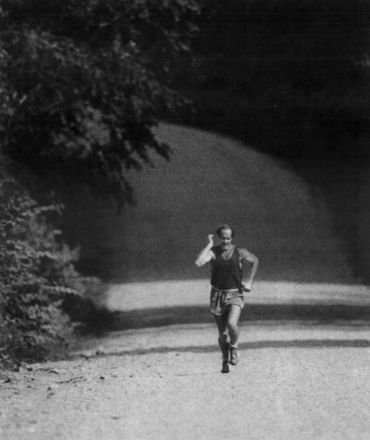 From 1983: Dan Gable drives hard near the end of a mile-plus run up a Mississippi River bluff near his Lansing, Iowa home.