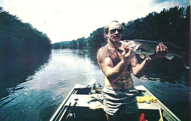 From 1983: Iowa wrestling coach Dan Gable shows off a 5-pound walleye caught on the Mississippi River near his home in Lansing.
