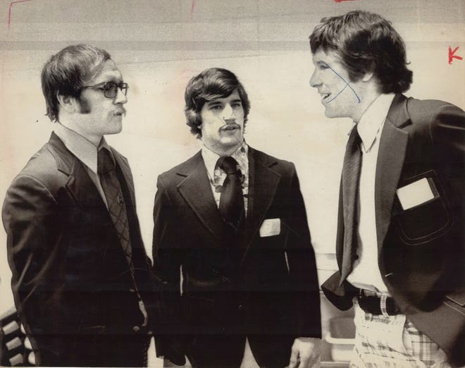 From 1975: Iowa assistant coach Dan Gable, left, meets with newly-named Hawkeyes co-captains for the upcoming season, Tim Cysewski, center, and Chuck Yagla.