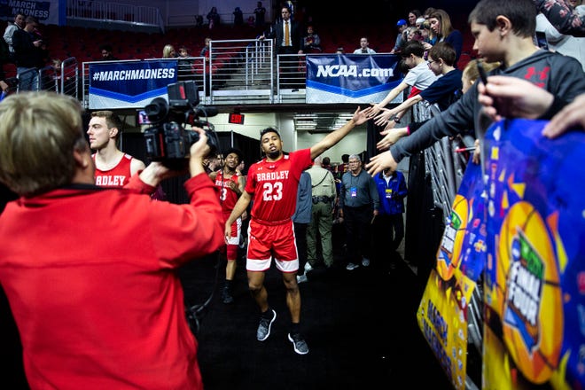 Bradley's Dwayne Lautier Ogunleye gives fives to people in the stands before Bradley's open practice before the first round of the NCAA Men's Basketball Tournament on Wednesday, March 20, 2019, at Wells Fargo Arena in Des Moines, Iowa.