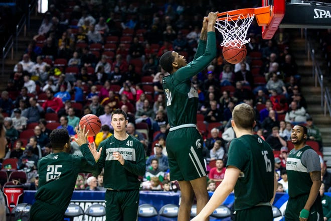 Michigan State's Marcus Bingham Jr. dunks the ball during Michigan State's open practice before the first round of the NCAA Men's Basketball Tournament on Wednesday, March 20, 2019, at Wells Fargo Arena in Des Moines, Iowa.
