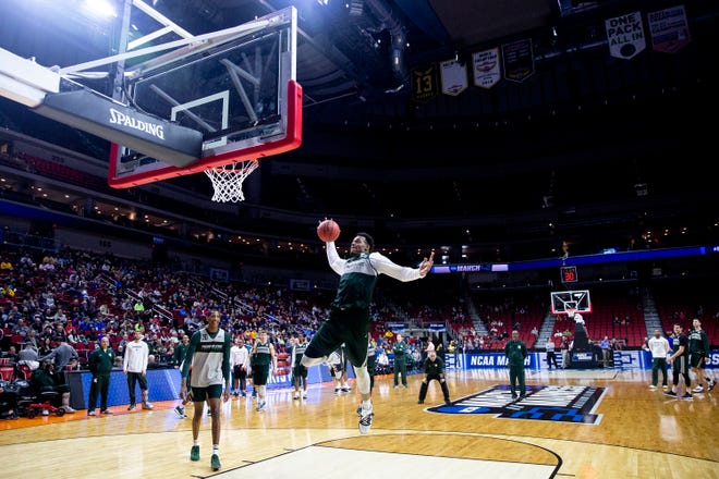 Michigan State's Xavier Tillman attempts a trick shot during Michigan State's open practice before the first round of the NCAA Men's Basketball Tournament on Wednesday, March 20, 2019, at Wells Fargo Arena in Des Moines, Iowa.