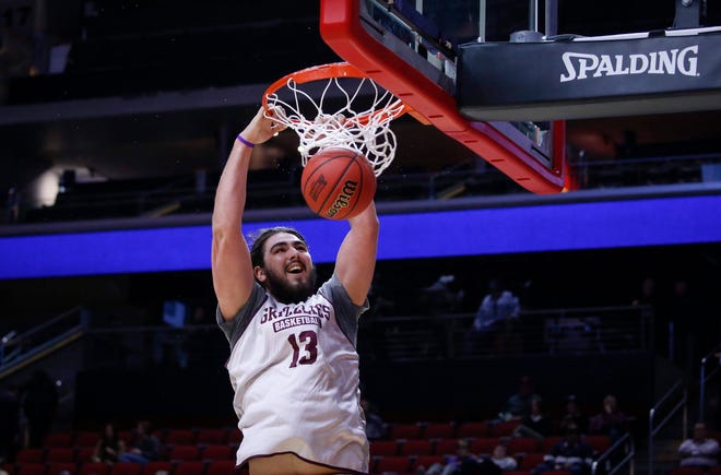 Montana freshman Ben Carter dunks the ball during open practice on Wednesday, March 20, 2019, at Wells Fargo Arena in Des Moines, Iowa.
