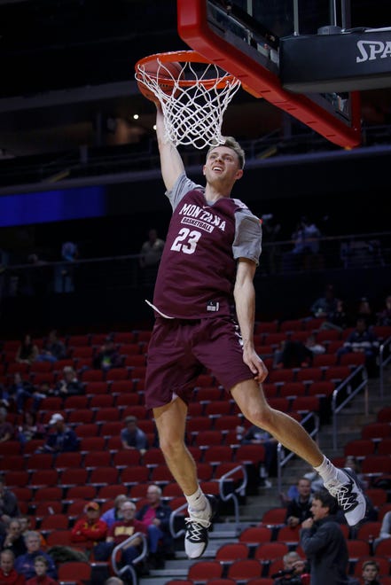 Montana freshman Mack Anderson dunks the ball during open practice on Wednesday, March 20, 2019, at Wells Fargo Arena in Des Moines, Iowa.