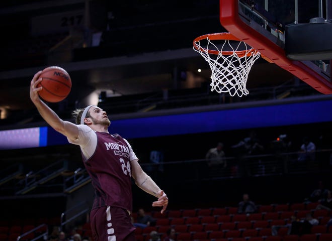Montana senior Bobby Moorehead dunks the ball during open practice on Wednesday, March 20, 2019, at Wells Fargo Arena in Des Moines, Iowa.