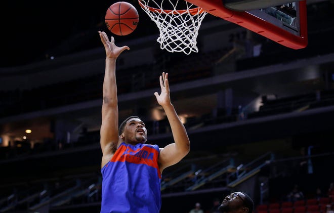 Florida freshman Isaiah Stokes puts the ball in the net during open practice on Wednesday, March 20, 2019, at Wells Fargo Arena in Des Moines, Iowa.
