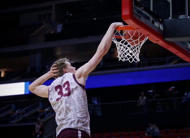 Montana freshman Kelby Kramer dabs as he dunks the ball during open practice on Wednesday, March 20, 2019, at Wells Fargo Arena in Des Moines, Iowa.