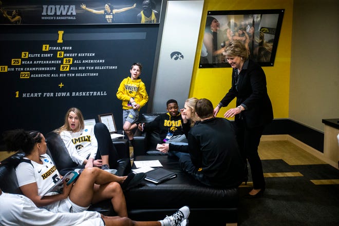 Iowa head coach Lisa Bluder talks with her children in the locker room after a NCAA women's basketball tournament second-round game, Sunday, March 24, 2019, at Carver-Hawkeye Arena in Iowa City, Iowa.