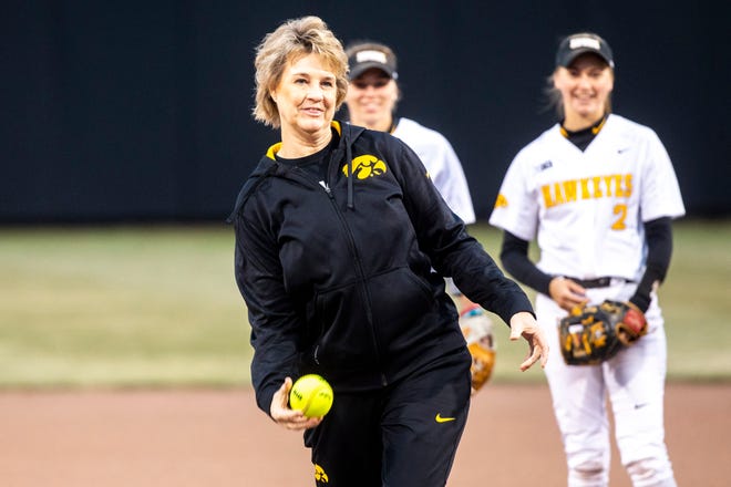 Iowa women's basketball head coach Lisa Bluder throws out the first pitch during a NCAA non conference softball game on Wednesday, March 27, 2019, at Bob Pearl Field in Coralville, Iowa.