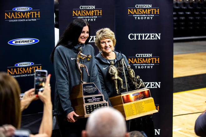 Iowa center Megan Gustafson, left, and Iowa head coach Lisa Bluder hold up their Citizen Naismith Trophies during a celebration of the 2018-19 Hawkeyes women's basketball season, Wednesday, April 24, 2019, at Carver-Hawkeye Arena in Iowa City, Iowa.