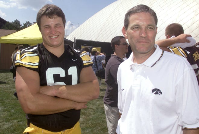 From 2003: Iowa offensive lineman Brian Ferentz laughs with his father, Iowa head coach Kirk Ferentz, during the team's media day Aug. 7, 2003, in Iowa City.