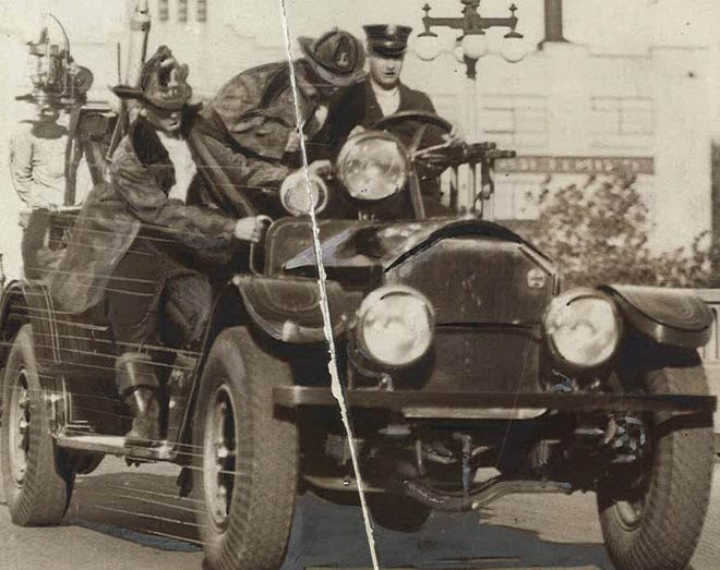 From 1930: Des Moines firefighters driving to the scene of a fire.