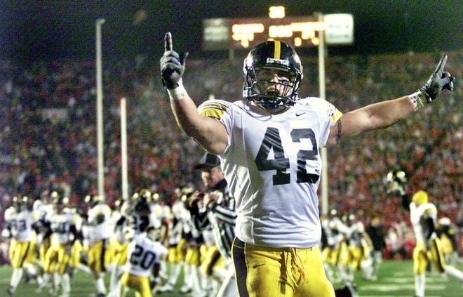Grant Steen celebrates the defense holding the Badgers out of the endzone in the final seconds to beat Wisconsin 27-21 in Madison on Nov. 22, 2002.