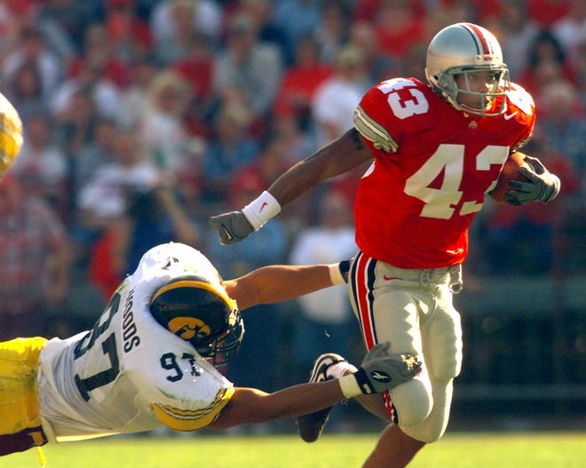 LeVar Woods tried to bring down Ohio State's Derek Combs during Iowa's game on Oct. 30, 1999 in Columbus, Ohio.