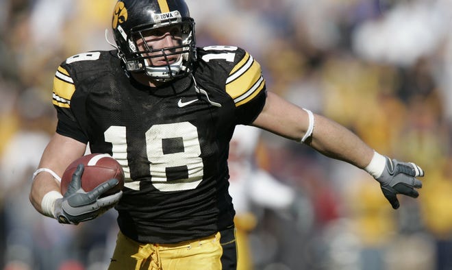 Chad Greenway (2002-2005) runs with the ball after intercepting a pass against Minnesota on Nov. 19, 2005 in Iowa City. Greenway was an All-American for the Hawkeyes and first-round draft pick of the Minnesota Vikings in 2006. He was selected to the Pro Bowl twice and finished his career with 1,101 tackles, 18 sacks and 11 interceptions, all with Minnesota.