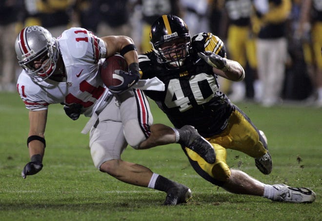 Ohio State's Anthony Gonzalez tries to elude Iowa linebacker Mike Klinkenborg during the third quarter of a game played Sept. 30, 2006 at Kinnick Stadium.