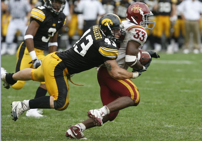 Iowa's Pat Angerer brings down Iowa State's Alexander Robinson in the fourth quarter of their game played Sept. 13, 2008 in Iowa City.