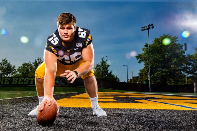 Tyler	Linderbaum stands for a photo during Hawkeye football media day Friday, Aug. 9, 2019.