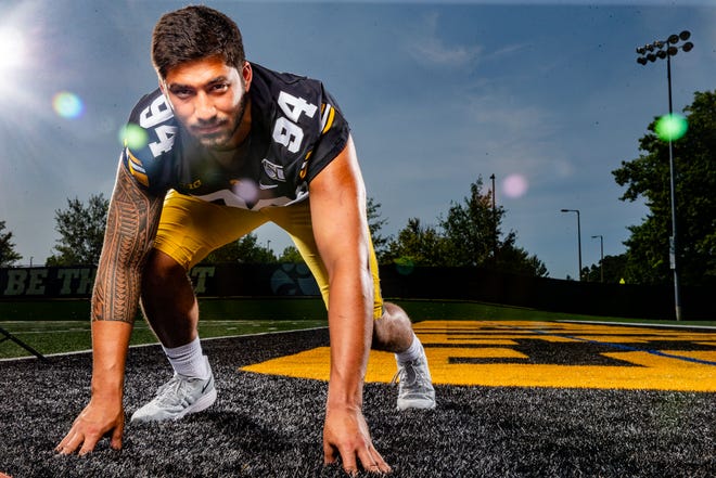 A.J. Epenesa stands for a photo during Hawkeye football media day Friday, Aug. 9, 2019.