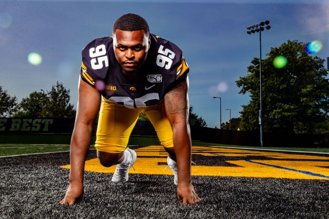 Cedrick Lattimore stands for a photo during Hawkeye football media day Friday, Aug. 9, 2019.