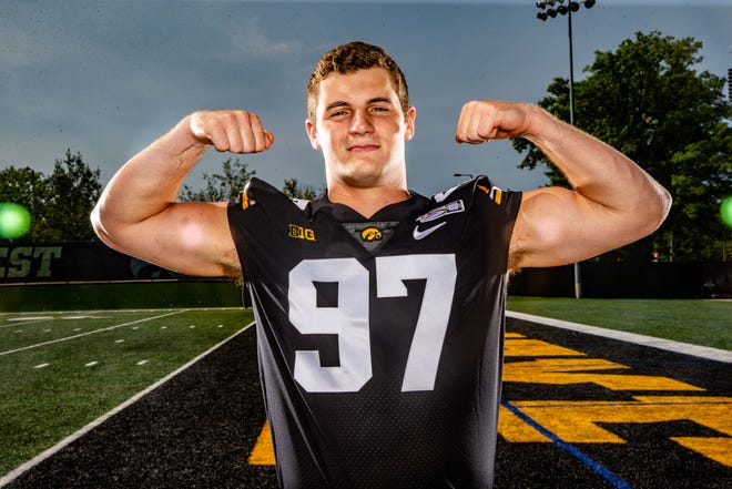 Zach	VanValkenburg stands for a photo during Hawkeye football media day Friday, Aug. 9, 2019.