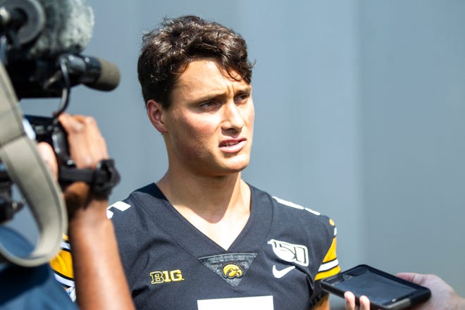 Iowa wide receiver Oliver Martin (5) talks with reporters during Hawkeyes football media day, Friday, Aug. 9, 2019, at the University of Iowa outdoor practice facility in Iowa City, Iowa.