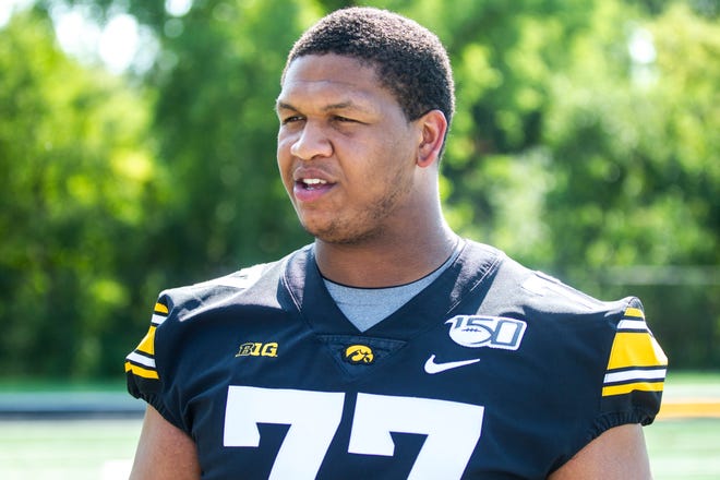 Iowa offensive lineman Alaric Jackson talks with reporters during Hawkeyes football media day, Friday, Aug. 9, 2019, at the University of Iowa outdoor practice facility in Iowa City, Iowa.
