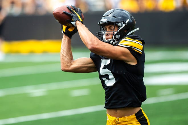 Iowa wide receiver Oliver Martin (5) catches a pass during a Hawkeyes football Kids Day scrimmage, Saturday, Aug. 10, 2019, at Kinnick Stadium in Iowa City, Iowa.