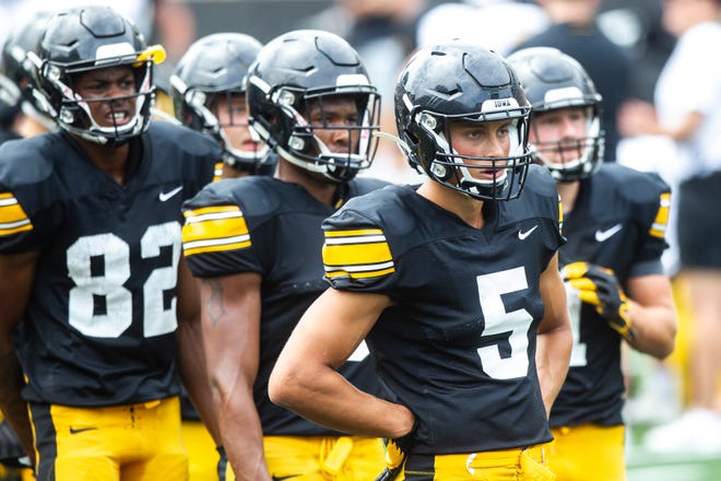 Iowa wide receiver Oliver Martin (5) stands with teammates during a Hawkeyes football Kids Day scrimmage, Saturday, Aug. 10, 2019, at Kinnick Stadium in Iowa City, Iowa.